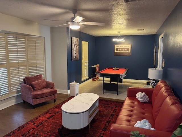 7003 Pyron Way Houston, TX 77036 - Photo 3 of 26 a living room with furniture a rug and a chandelier