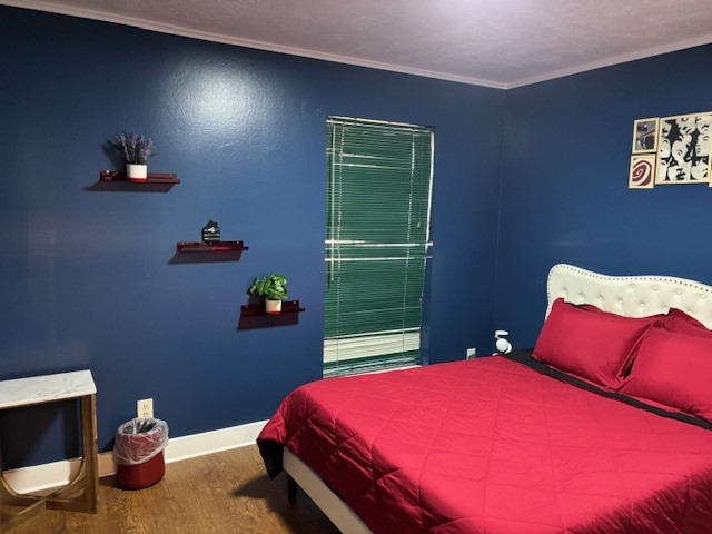 7003 Pyron Way Houston, TX 77036 - Photo 9 of 26 a bedroom with a bed and a dresser