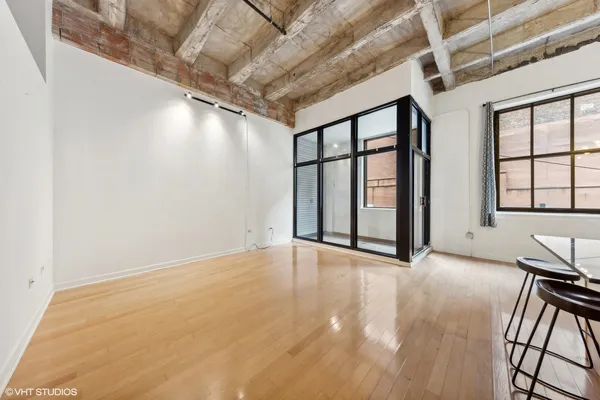 a view of an empty room with a window