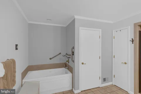 a bathroom with a double vanity sink a mirror and a shower