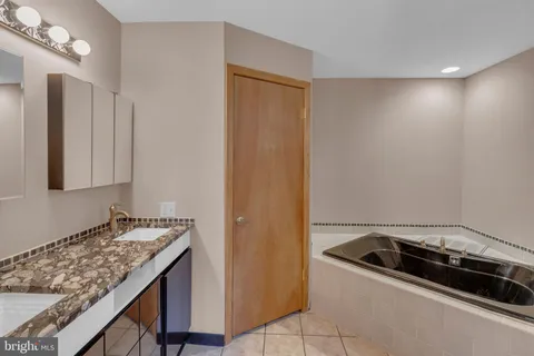 a bathroom with a sink and a shower