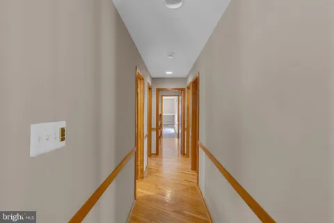 a bedroom with a bed chair and a window