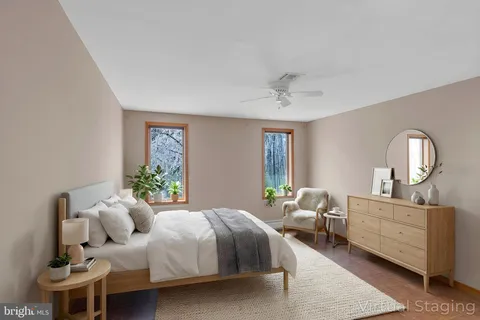 an empty room with windows and closet