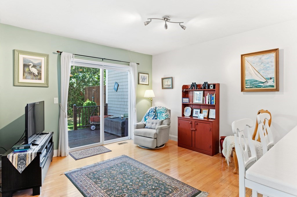 1 Prestwick Road, Unit 1 Bourne, MA 02532 - Photo 14 of 31 a bedroom with furniture and a rug