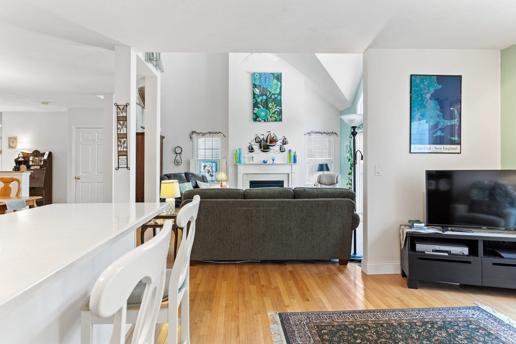 1 Prestwick Road, Unit 1 Bourne, MA 02532 - Photo 16 of 31 a living room with furniture and a flat screen tv