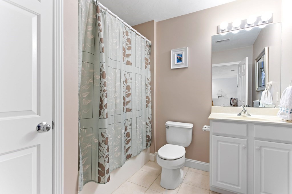 1 Prestwick Road, Unit 1 Bourne, MA 02532 - Photo 20 of 31 a bathroom with a toilet sink and shower