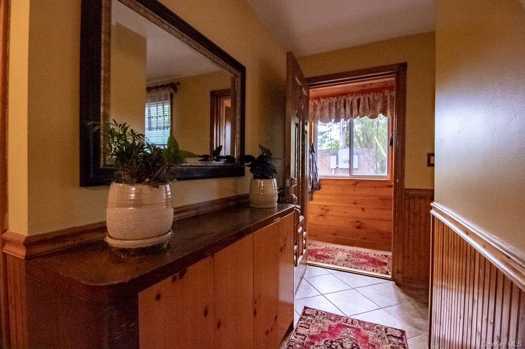1105 Ulster Heights Road Ellenville, NY 12428 - Photo 29 of 36 Corridor featuring light tile patterned floors