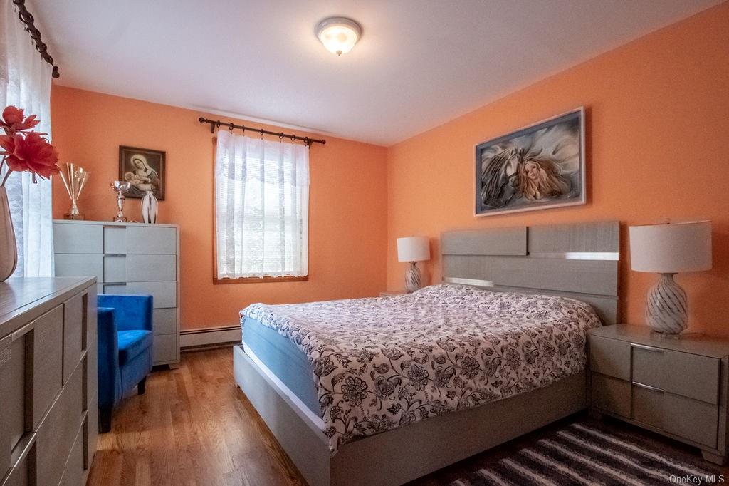 1105 Ulster Heights Road Ellenville, NY 12428 - Photo 32 of 36 Bedroom with a baseboard radiator and hardwood / wood-style flooring