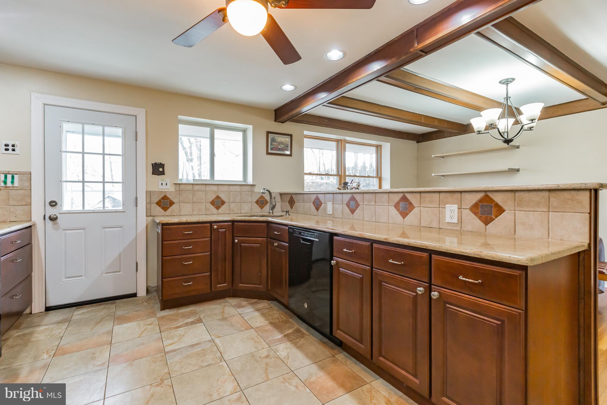 1675 Larkin Road Boothwyn, PA 19061 - Photo 6 of 31 Tiled kitchen w/granite counters