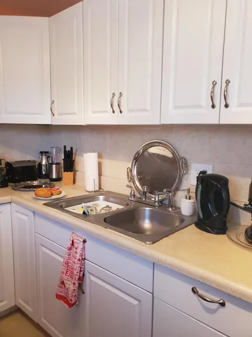 a kitchen with a stove and cabinets