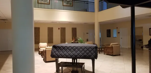 a view of a patio with a table and chairs and potted plants