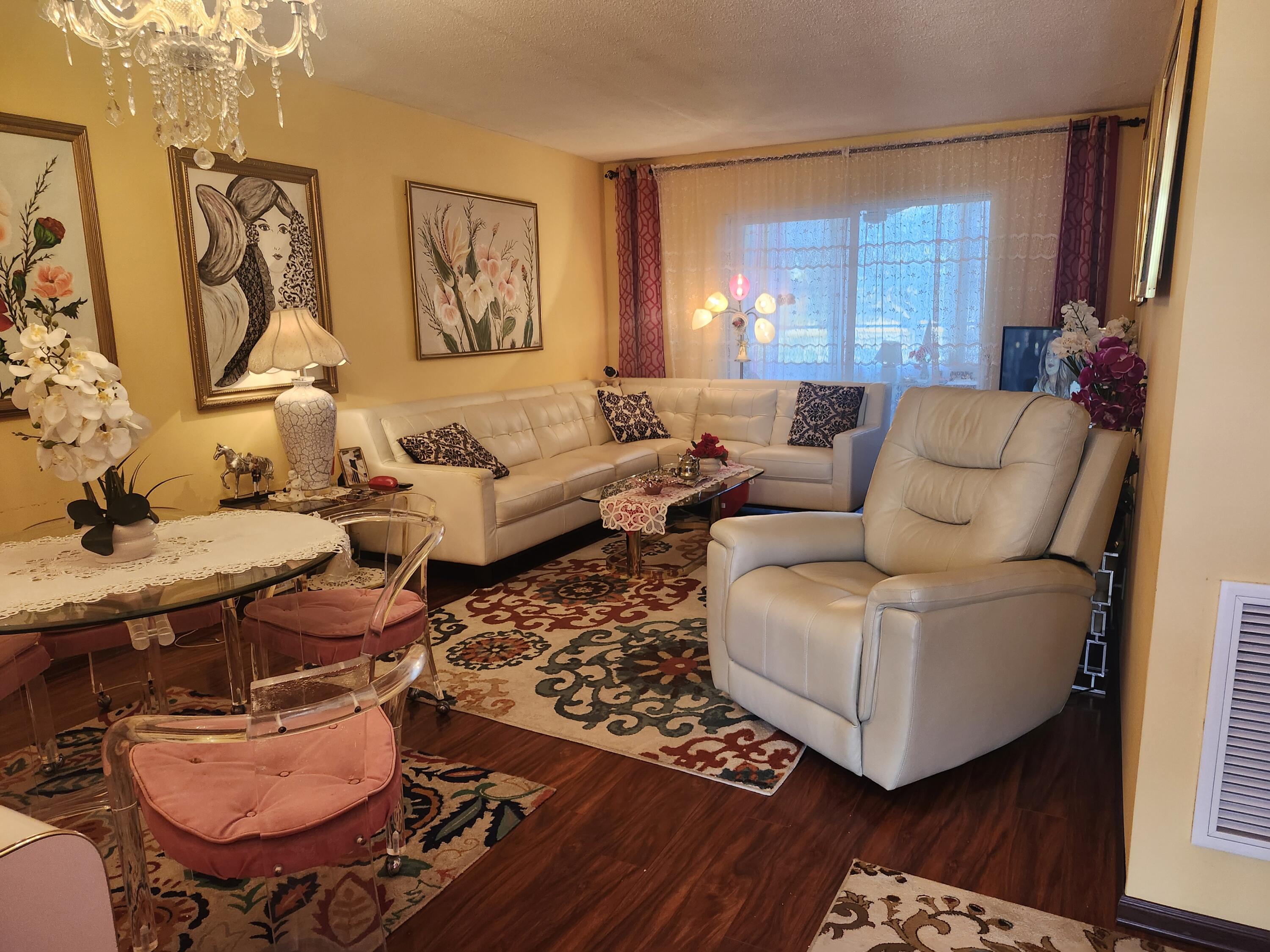 2400 Northeast 1st Lane, Unit 206 Boynton Beach, FL 33435 - Photo 9 of 32 a living room with furniture and a window