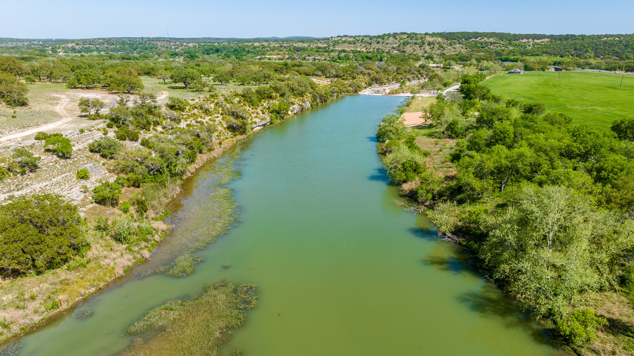 Lot 2 Byrd Ranch Road Johnson City, TX 78636 - Photo 37 of 40 Birds eye view of property featuring a forest view and a water view