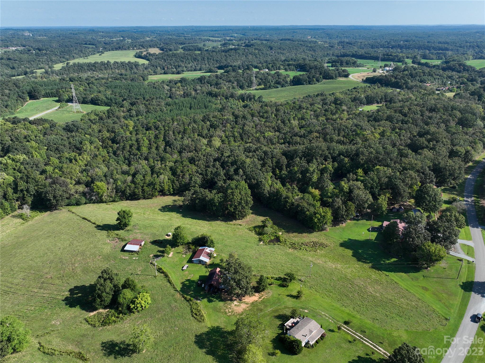 0 Santa Claus Road Monroe, NC 28110 - Photo 16 of 43 a view of a lush green field with lots of flower plants