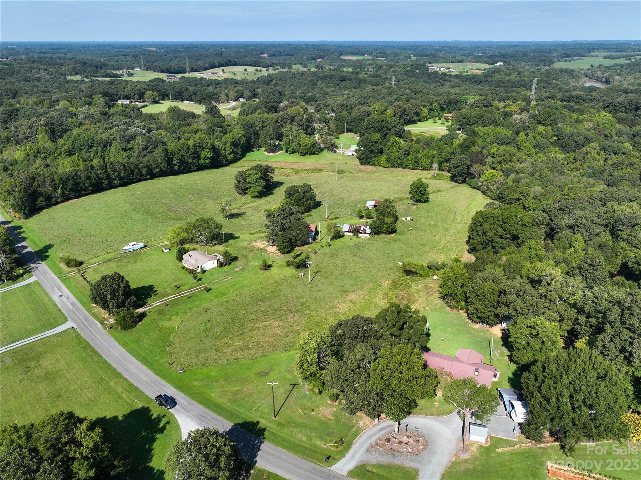 0 Santa Claus Road Monroe, NC 28110 - Photo 24 of 43 an aerial view of a residential houses with outdoor space and trees