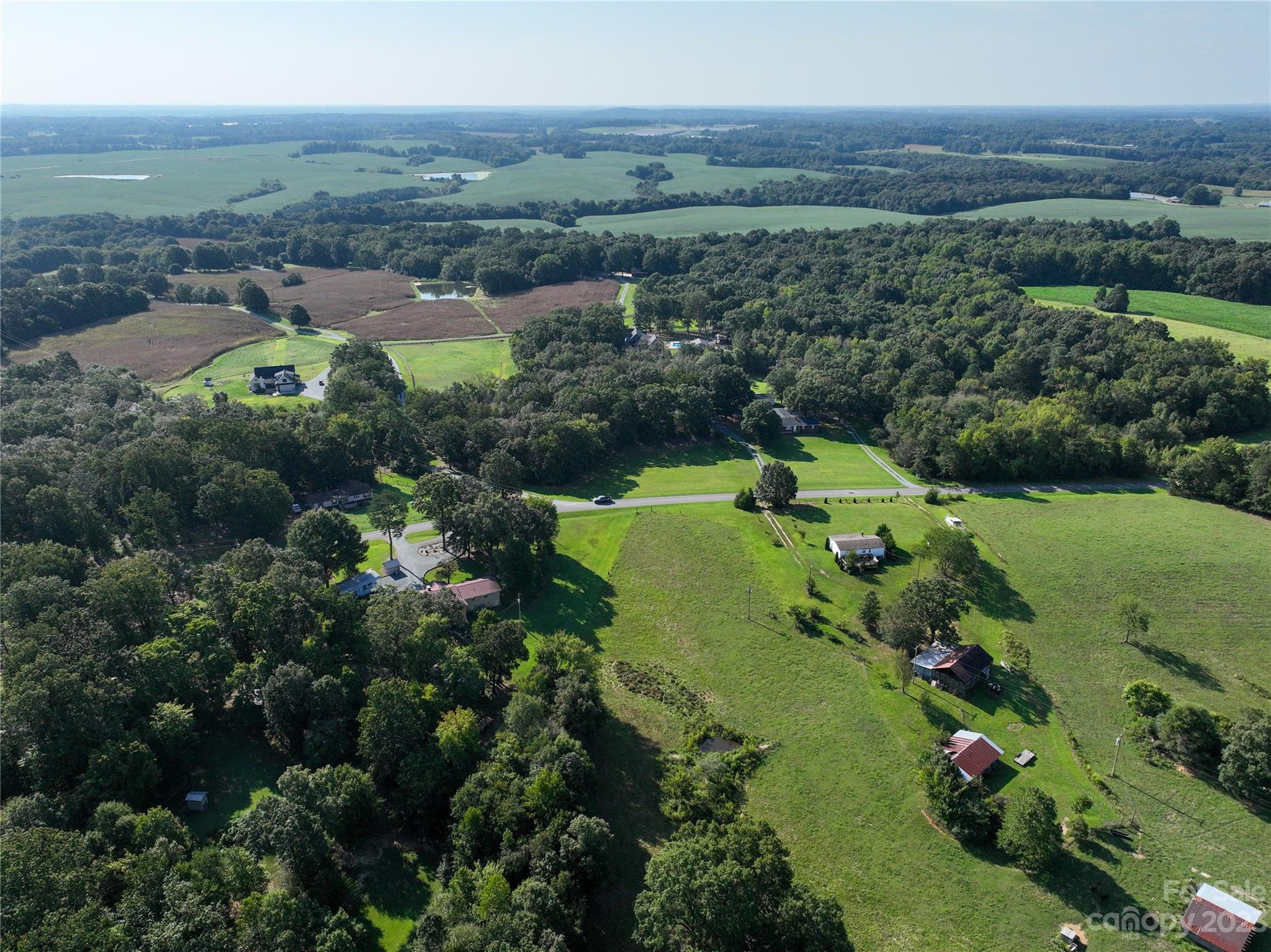 0 Santa Claus Road Monroe, NC 28110 - Photo 5 of 43 an aerial view of a houses with a yard