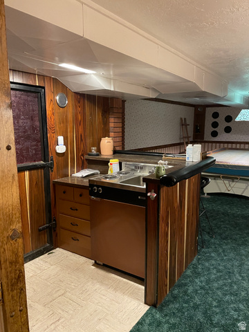 438 East Main Street Elsinore, UT 84724 - Photo 42 of 43 Compact kitchenette featuring a dual-burner cooktop, integrated sink, and under-counter refridgerator