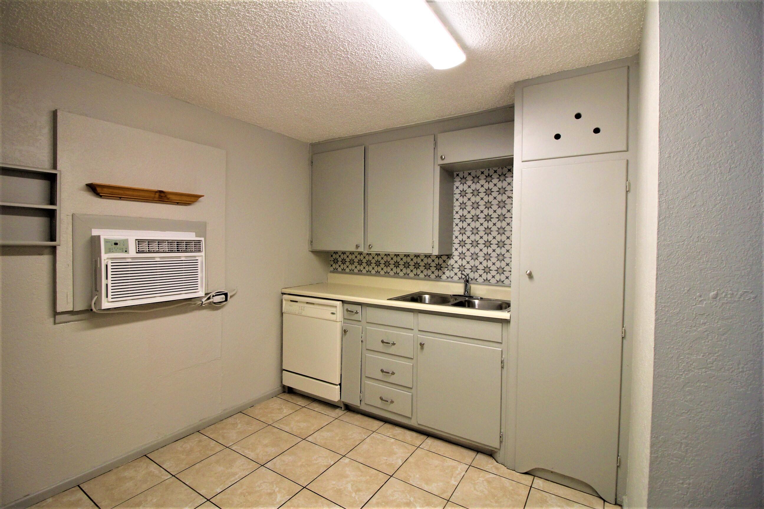 2216 30th Street Lubbock, TX 79411 - Photo 15 of 21 a view of cabinets with wooden floor