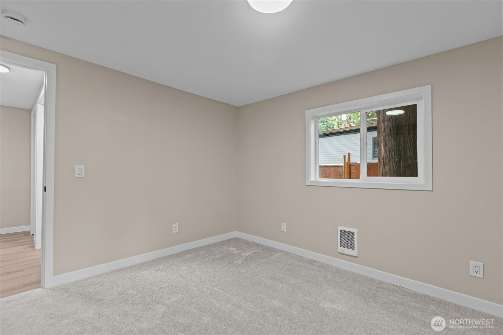 1729 194th Street Southeast, Unit 6 Bothell, WA 98012 - Photo 13 of 26 an empty room with a window