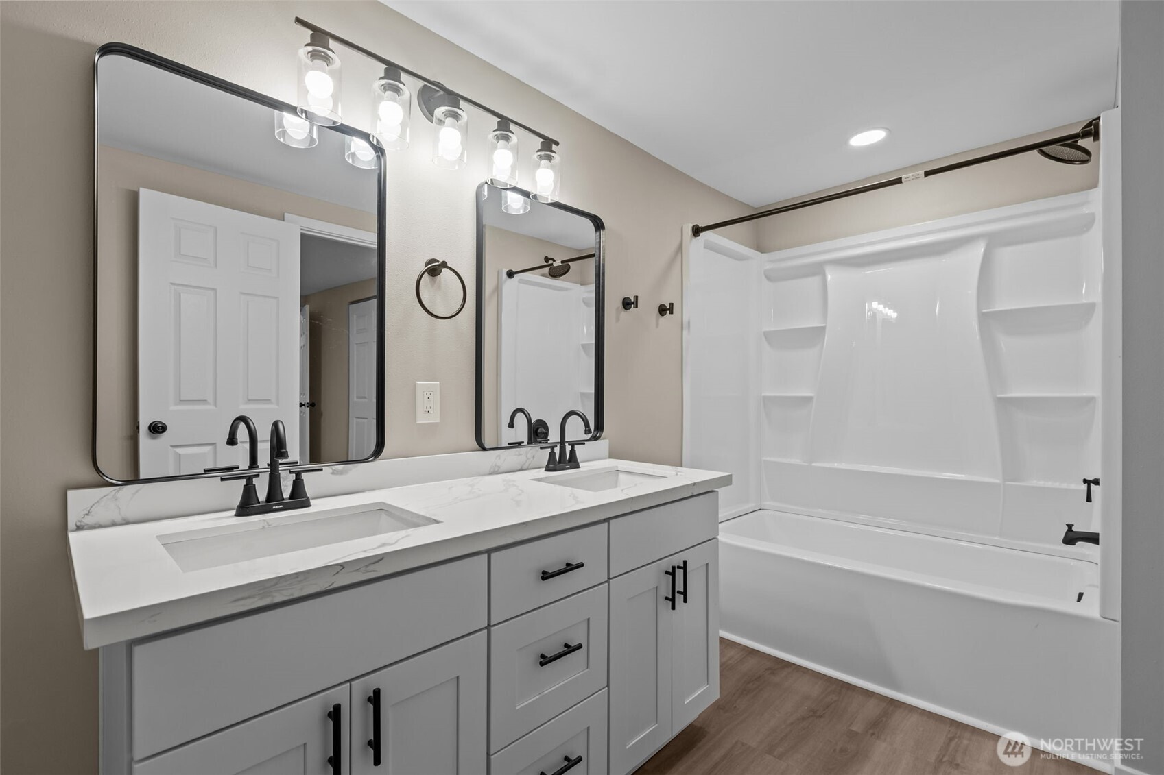 1729 194th Street Southeast, Unit 6 Bothell, WA 98012 - Photo 14 of 26 a bathroom with a bathtub shower sink double vanity and a mirror