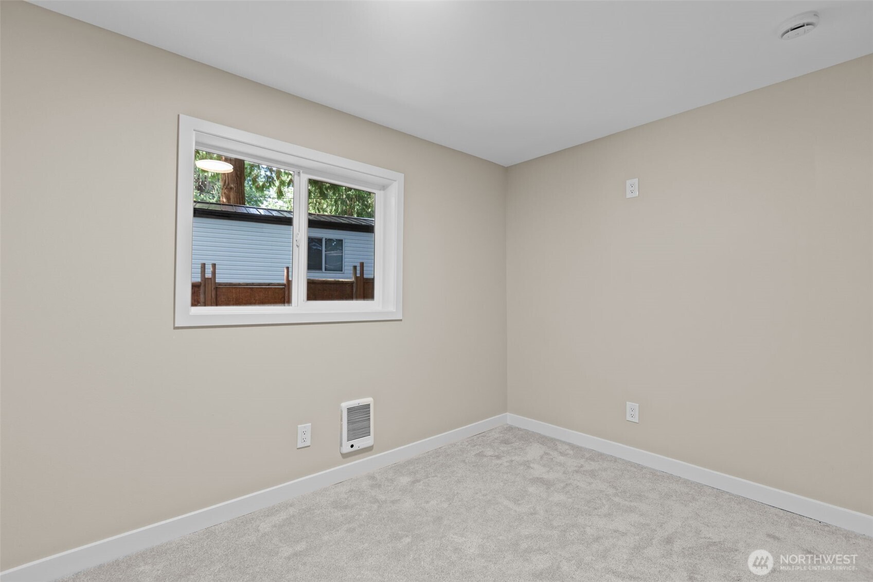 1729 194th Street Southeast, Unit 6 Bothell, WA 98012 - Photo 18 of 26 an empty room with a window