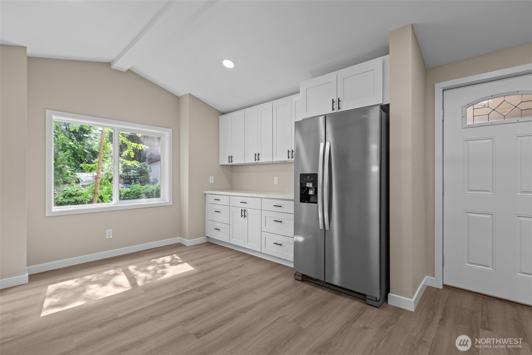 1729 194th Street Southeast, Unit 6 Bothell, WA 98012 - Photo 6 of 26 a kitchen with stainless steel appliances a refrigerator sink and cabinets