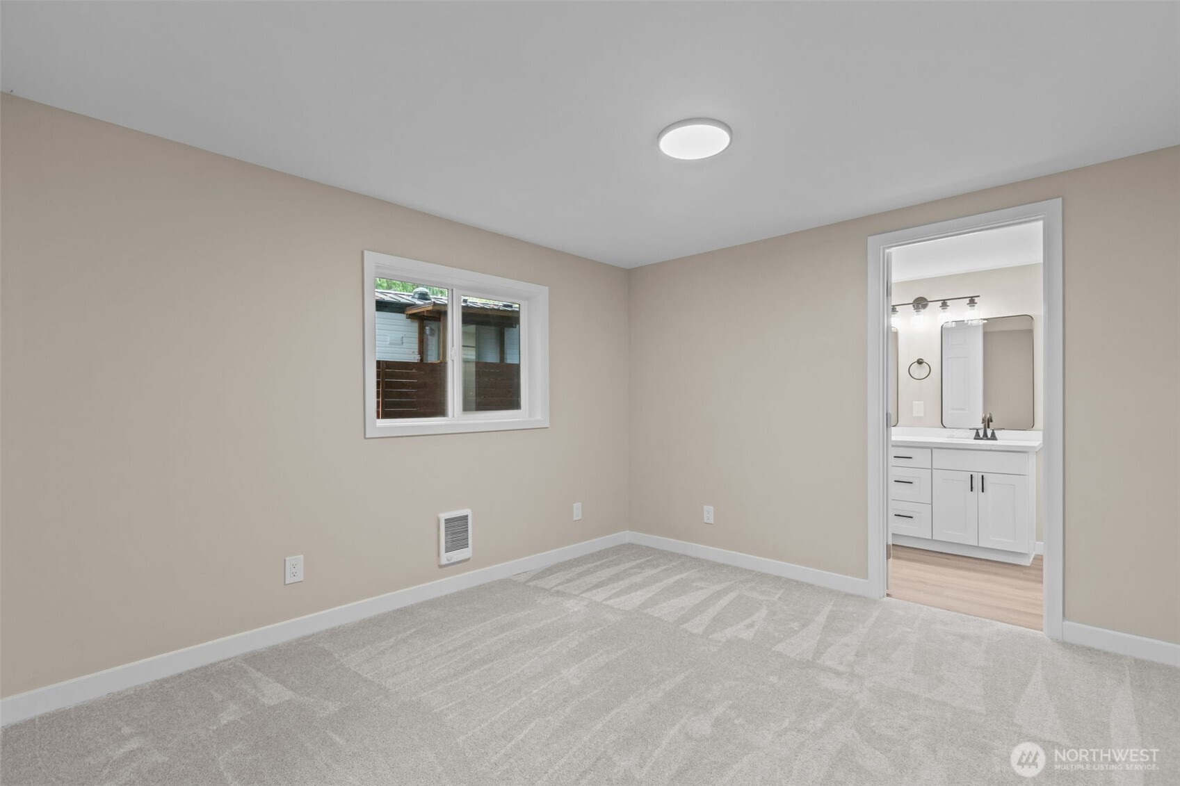 1729 194th Street Southeast, Unit 6 Bothell, WA 98012 - Photo 10 of 26 a view of an empty room with closet and a window