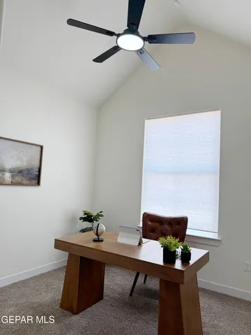 a view of a workspace with furniture