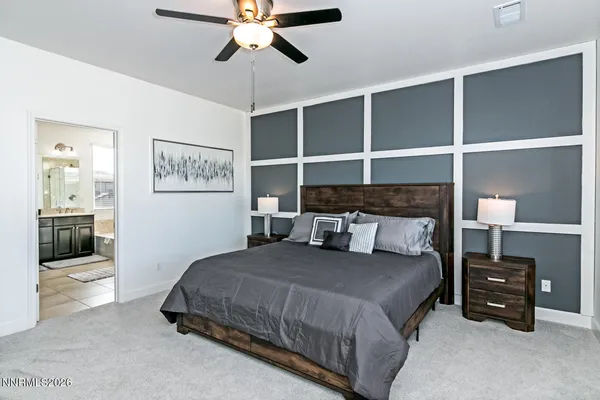 a bedroom with a bed and walk in closet