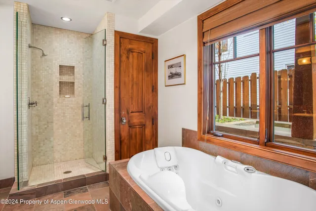 a bathroom with a toilet a sink and a mirror