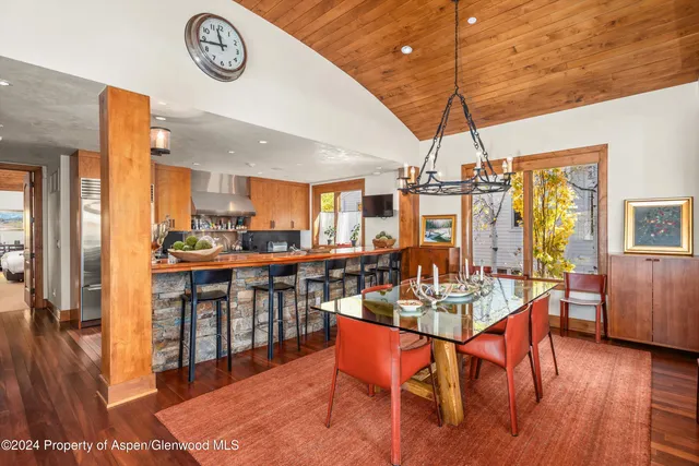 front view of a building with a tree