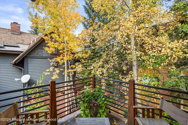 a bathroom with a double vanity sink mirror and shower