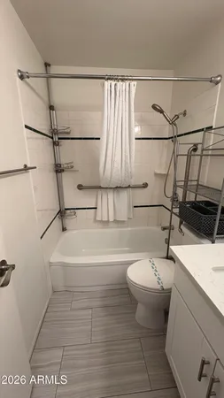 a bathroom with a sink a toilet and bathtub