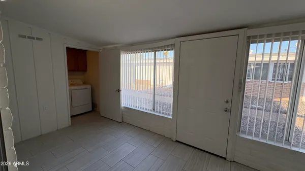 a view of an empty room with a window