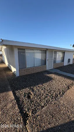 a view of a backyard of a house