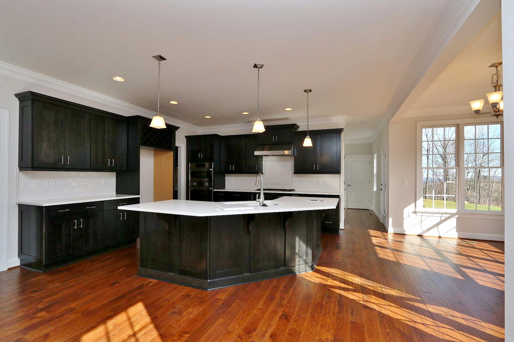 6875 Fairway Ridge Road Salem, VA 24153 - Photo 14 of 91 a large kitchen with stainless steel appliances a large counter top a stove and a wooden floors