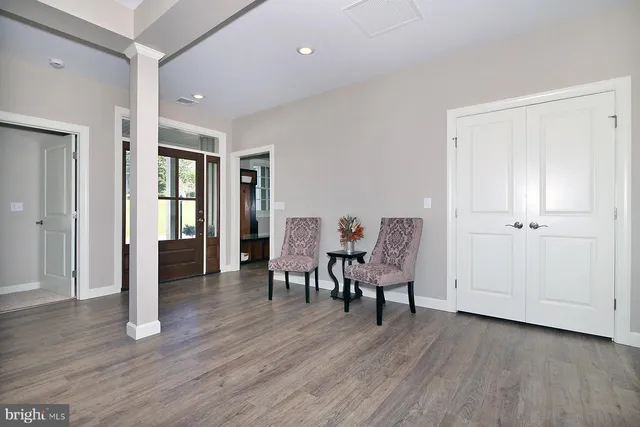 a view of a livingroom with furniture and wooden floor