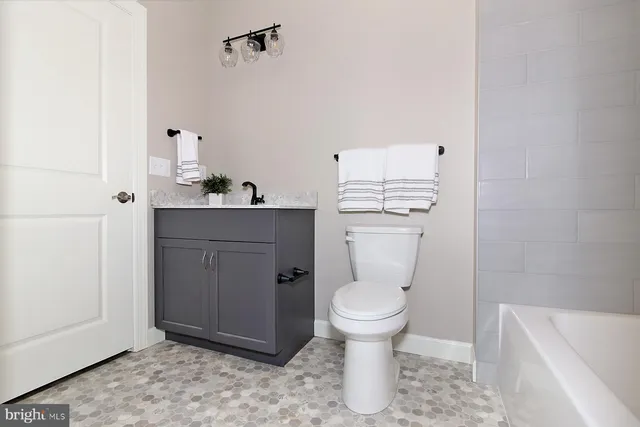 a room with a toilet and a sink