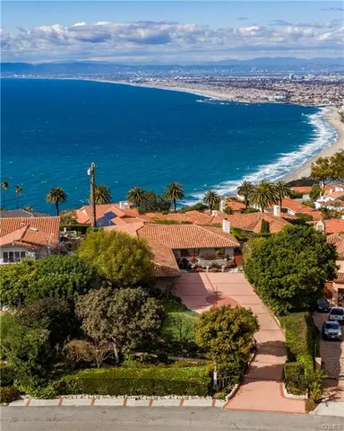 a view of a balcony with wooden floor and city view