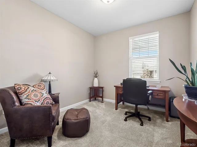 a workspace with furniture and a window