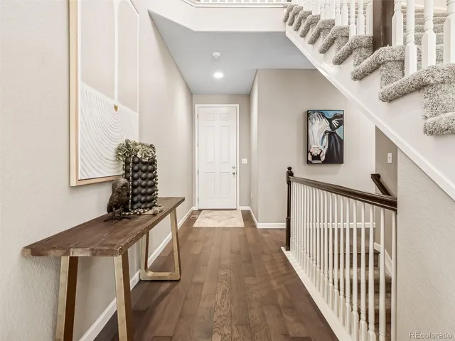 a view of entryway with wooden floor