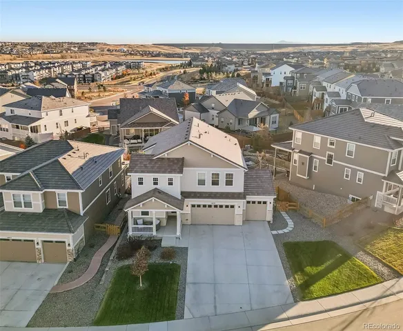 an aerial view of a house with a big yard