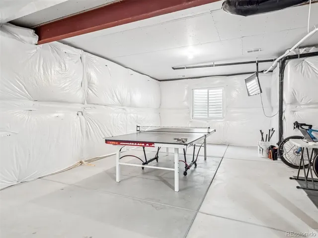 a view of a room with table and chairs