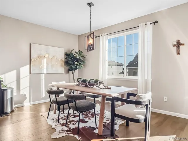 a view of a dining room with furniture window and outside view
