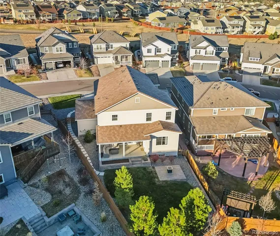 an aerial view of a residential houses with outdoor space