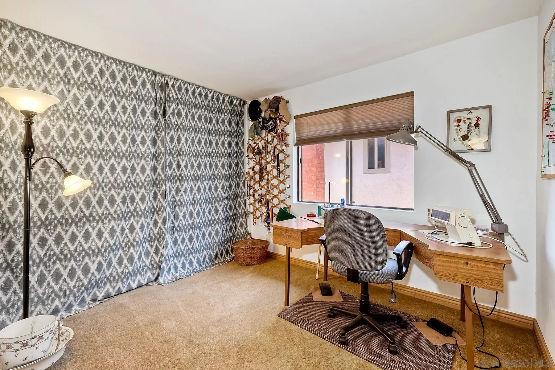 3805 Catamarca Drive San Diego, CA 92124 - Photo 25 of 59 a view of a workspace with furniture and a window