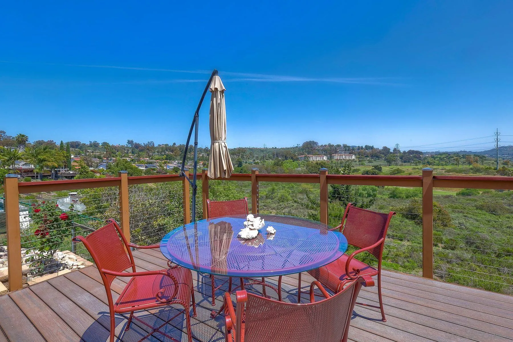 3805 Catamarca Drive San Diego, CA 92124 - Photo 31 of 59 a view of a chairs and table in patio with a lake view