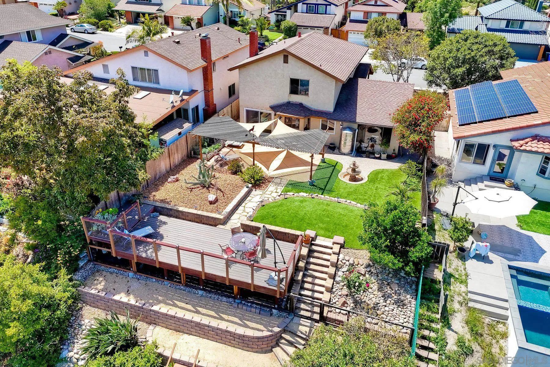 3805 Catamarca Drive San Diego, CA 92124 - Photo 4 of 59 an aerial view of a house with a garden and lake view