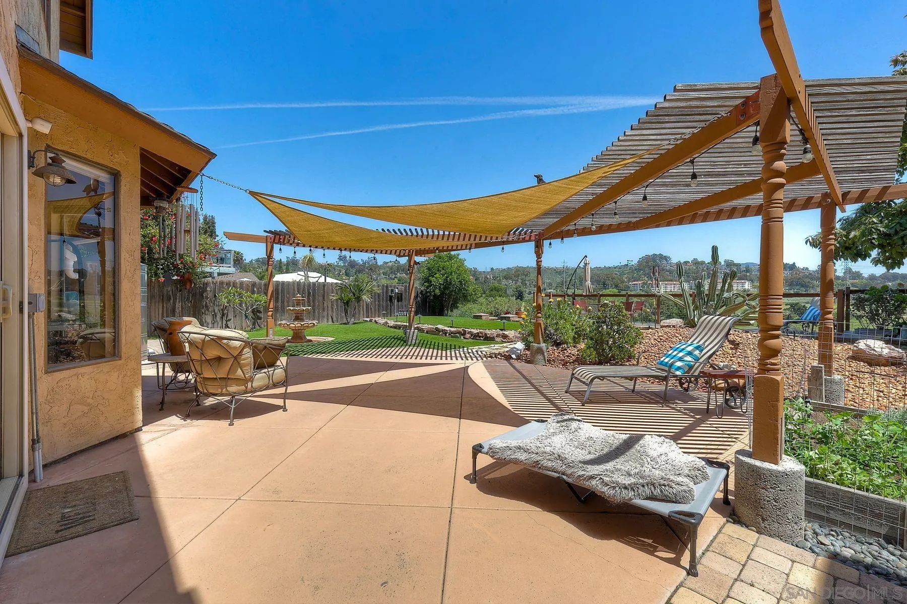 3805 Catamarca Drive San Diego, CA 92124 - Photo 5 of 59 a view of swimming pool with outdoor seating and a yard