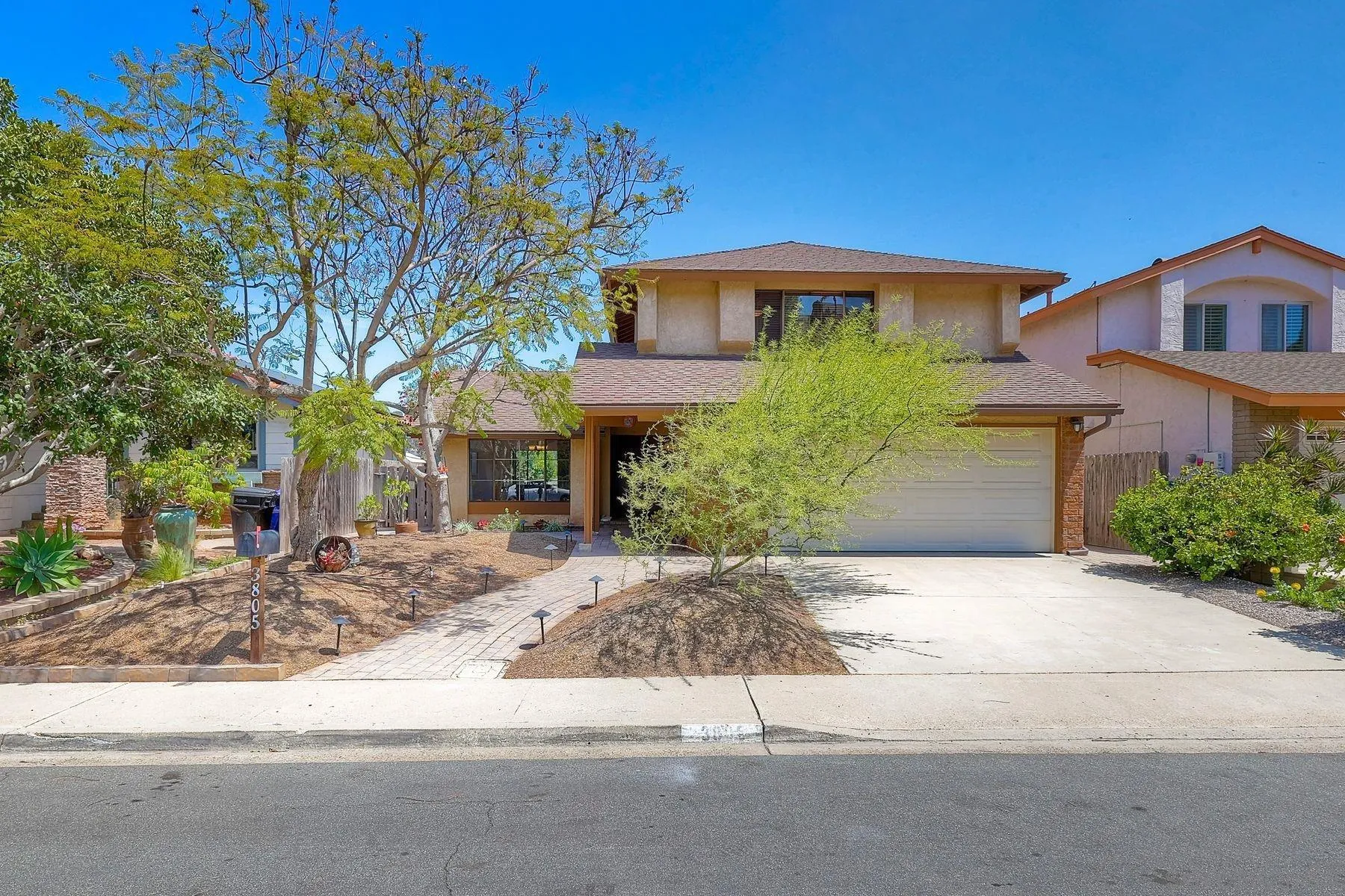 3805 Catamarca Drive San Diego, CA 92124 - Photo 54 of 59 front view of a house with a bench